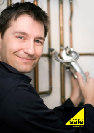 Gas engineer fixing a boiler